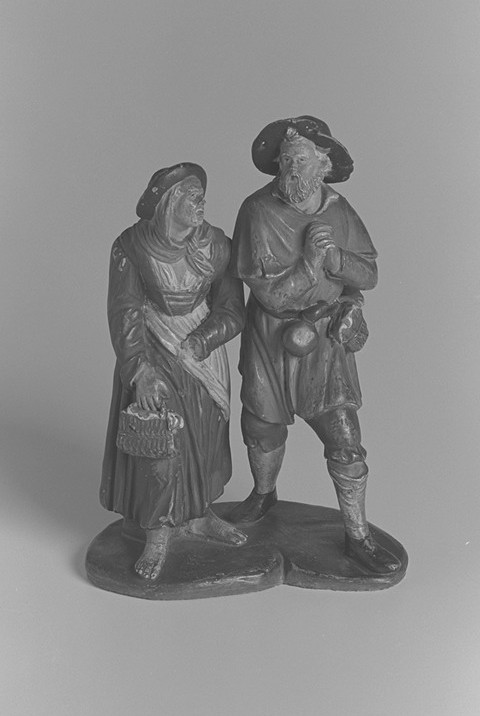 Statuetta di presepe con contadini al desco